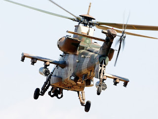 The rear view of a Rooivalk in flight The rear view of a Rooivalk in flight